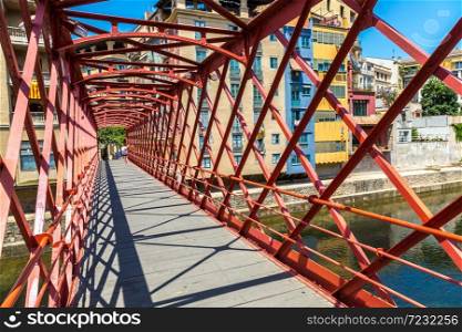 Red iron bridge - Eiffel bridge in Girona, in a beautiful summer day, Catalonia, Spain