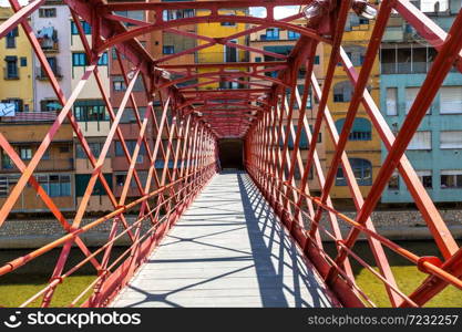 Red iron bridge - Eiffel bridge in Girona, in a beautiful summer day, Catalonia, Spain