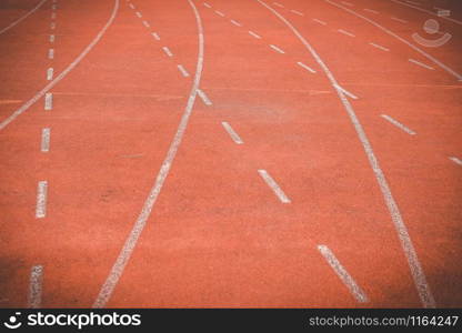 red lane running racetrack backstretch in outdoor sports stadium arena