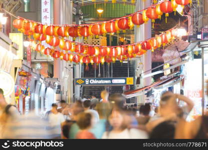 Red lantern that is decorated. Decorated in the night time in the Chinese district