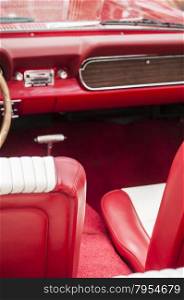 Red leather interior detail of retro classic sports vintage car