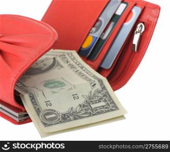 Red leather wallet with dollars and credit cards. It is isolated on a white background