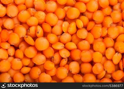 red lentils heap closeup as a background