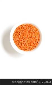 Red lentils on a white bg