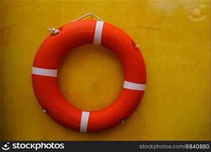 Red lifebuoy on the wall