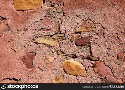 Red limestone masonry wall with rodeno mortar texture background