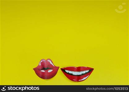 red lips depicting various emotions on a yellow background copy space, abstract background.. red lips depicting various emotions on a yellow background copy space, abstract background