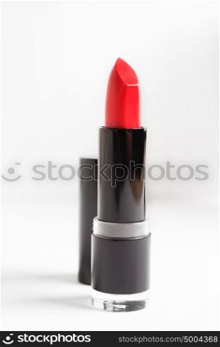 Red lipstick on white background