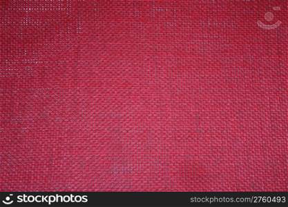 Red loosely woven fabric to be used as a background