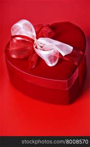 red love heart gift box over red