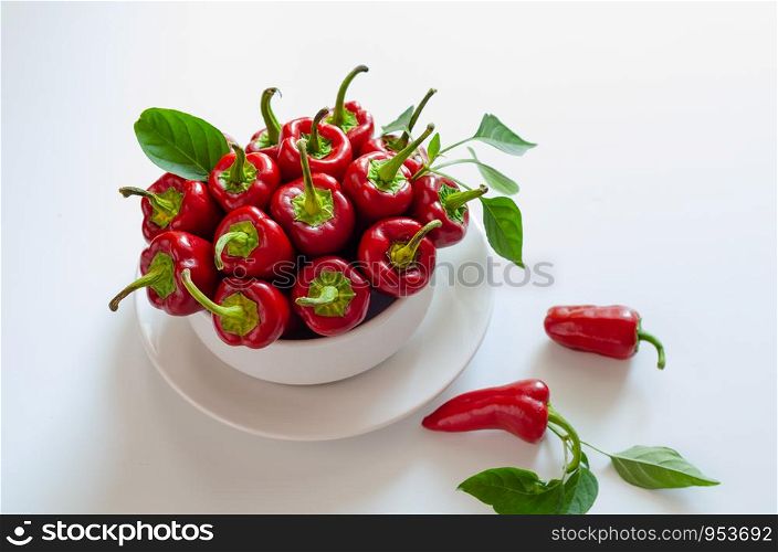 Red Mara? peppers in bowl on white background. Top view.