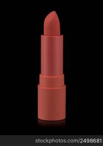 Red matte lipstick isolated on black background. Velvet satin airy lip stick new open.