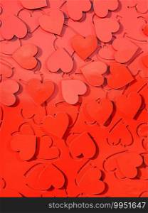 Red metal hearts in sunlight, installation of the symbol of love.. Red metal hearts, love symbol installation.
