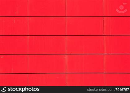 Red metal panel wall of contemporary office buildind facade closeup as background