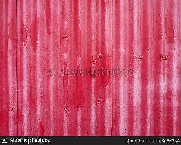 Red metal texture background. Red corrugated metal texture useful as a background