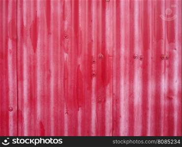 Red metal texture background. Red corrugated metal texture useful as a background
