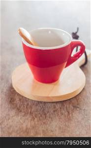 Red mug with wooden plate, stock photo