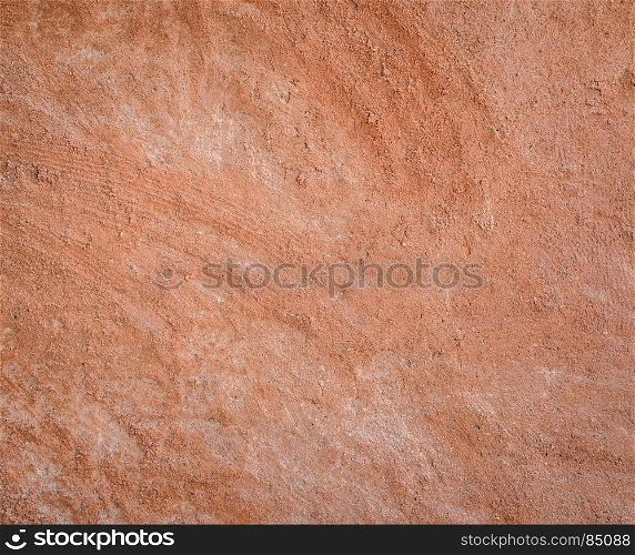 Red natural wall texture of cob house for background. It is a natural building material made from subsoil, water and straw fibrous organic material.