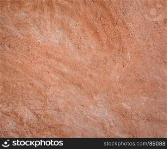 Red natural wall texture of cob house for background. It is a natural building material made from subsoil, water and straw fibrous organic material.