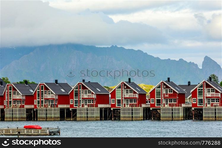 Red norwegian fishing houses rorbu at pier in Svolvaer, Lototen islands, Austvagoya, Vagan Municipality, Nordland County, Norway