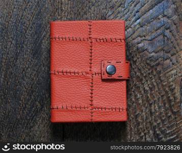Red Notebook on the wooden background