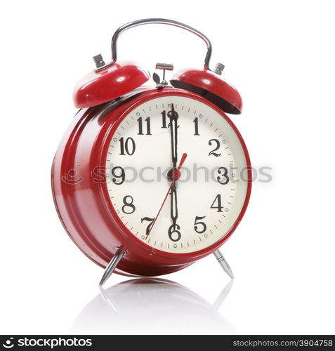 red old style alarm clock isolated on white