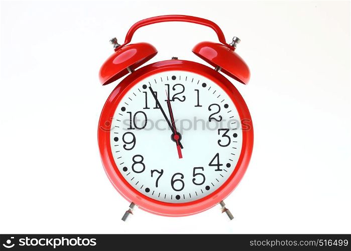 red old style alarm clock isolated on white