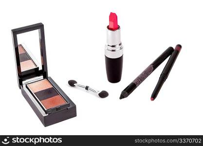 Red open lipstick, shadows and pens isolated on white background