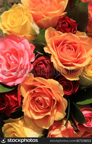 Red, orange and yellow roses in a mixed rose bouquet