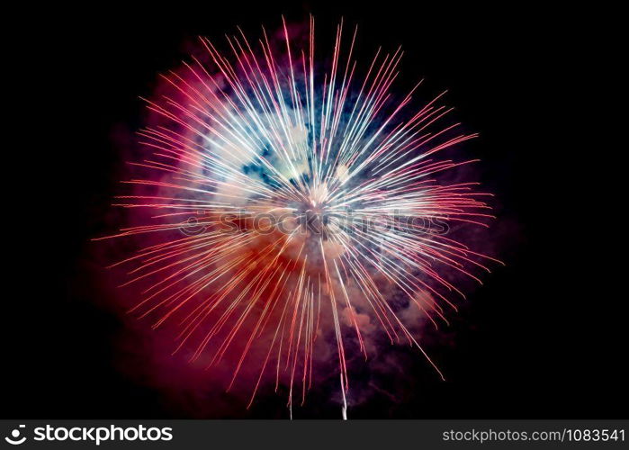 Red Orange Sparkling Fireworks Background on Night Scene. Abstract color fireworks background and smoke on sky