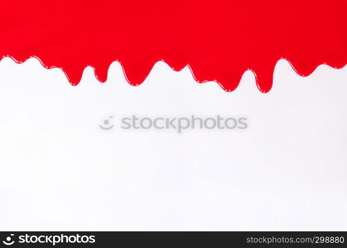 Red paint dripping on a white background