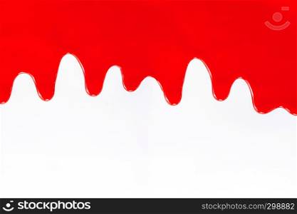 Red paint dripping on a white background
