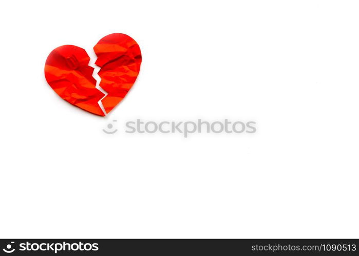 Red paper broken heart on white background. Love concept. Divorce. Copyspace. Red paper broken heart on white background