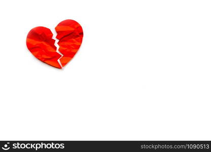 Red paper broken heart on white background. Love concept. Divorce. Copyspace. Red paper broken heart on white background