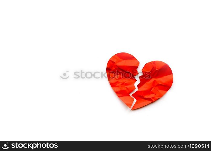 Red paper broken heart on white background. Love concept. Divorce. Copyspace. Red paper broken heart on white background
