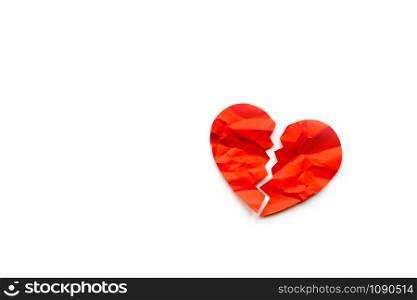 Red paper broken heart on white background. Love concept. Divorce. Copyspace. Red paper broken heart on white background