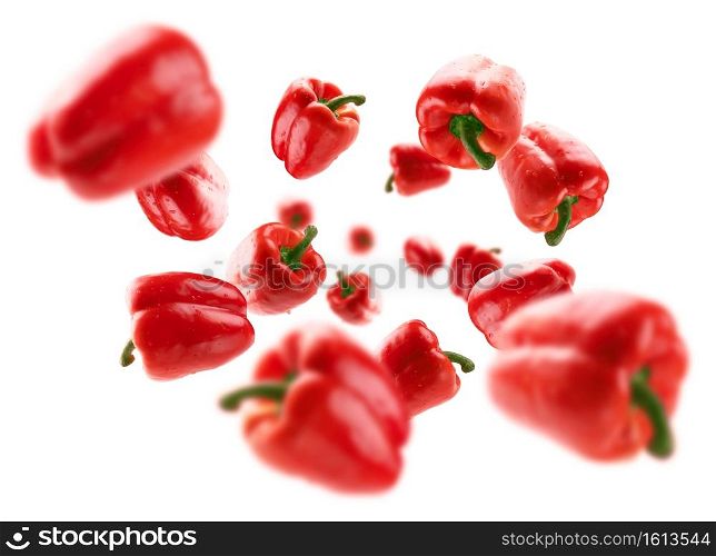 Red paprika levitates on a white background.. Red paprika levitates on a white background