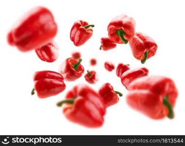 Red paprika levitates on a white background.. Red paprika levitates on a white background