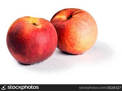 red peaches isolated on white with shadows