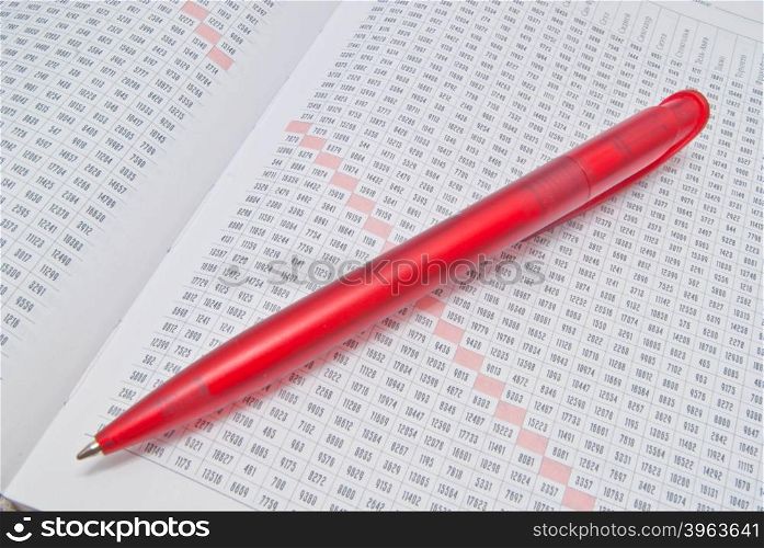 red pen and diary on white background
