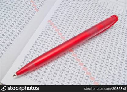 red pen and diary on white background