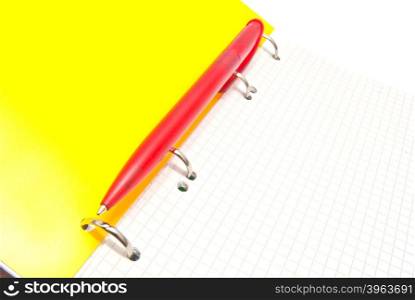 red pen on notebook on white background