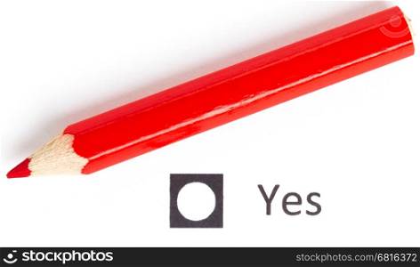 Red pencil choosing between yes or no (voting)