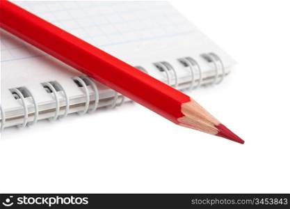 red pencils and notebook isolated on a white background