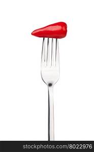 red pepper on a fork. red pepper on a fork. Isolated on a white background