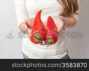red peppers in hands