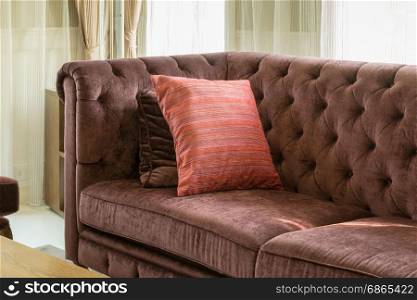 red pillows on red sofa in luxury living room interior