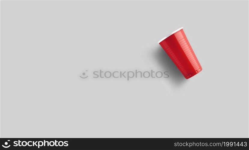 Red plastic cup isolated on grey. Beer pong game concept