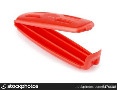 Red plastic food bag clip isolated on white
