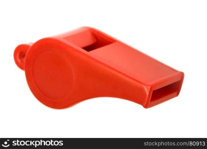 Red plastic whistle on a white background